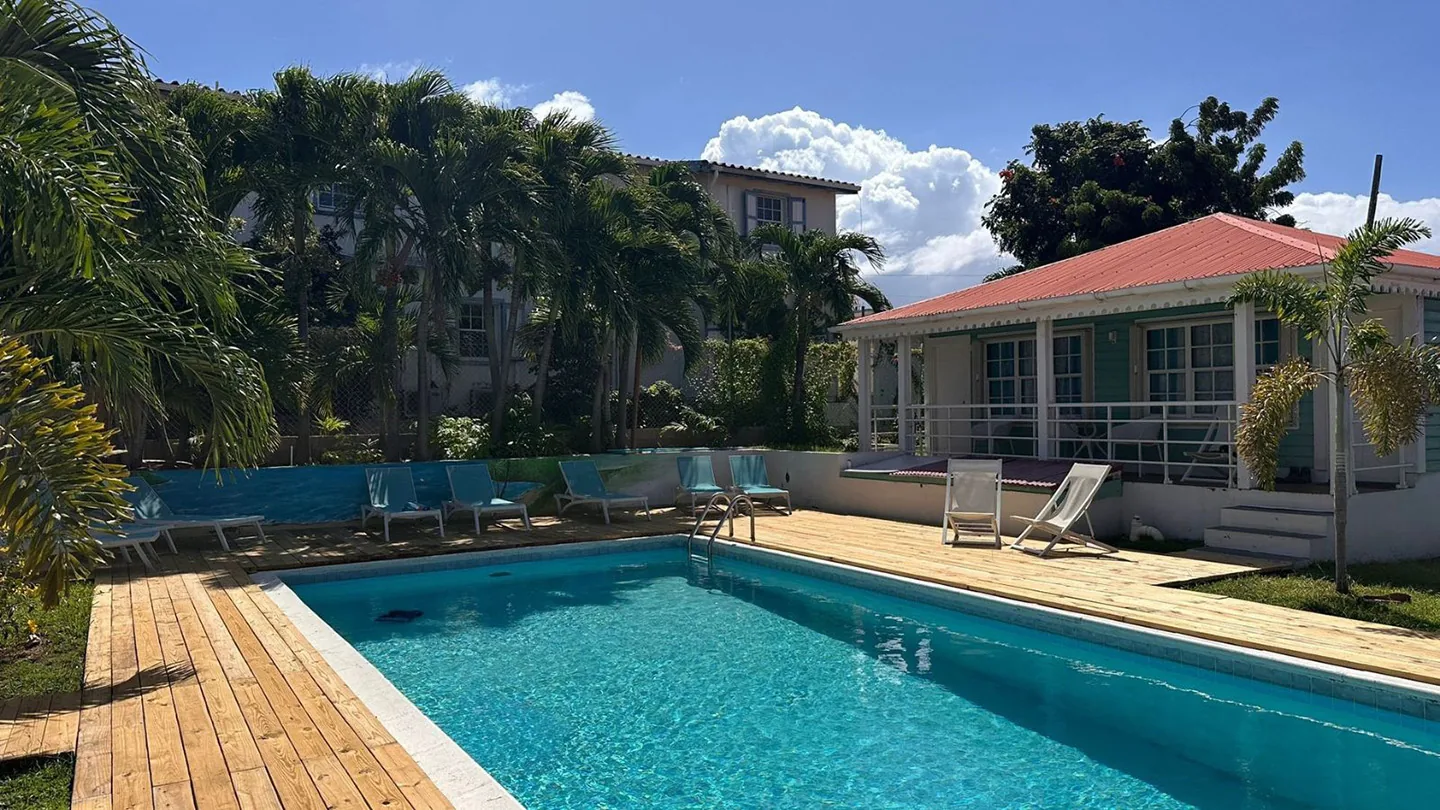 The pool and sundeck at Talk of the Town Inn & Suites