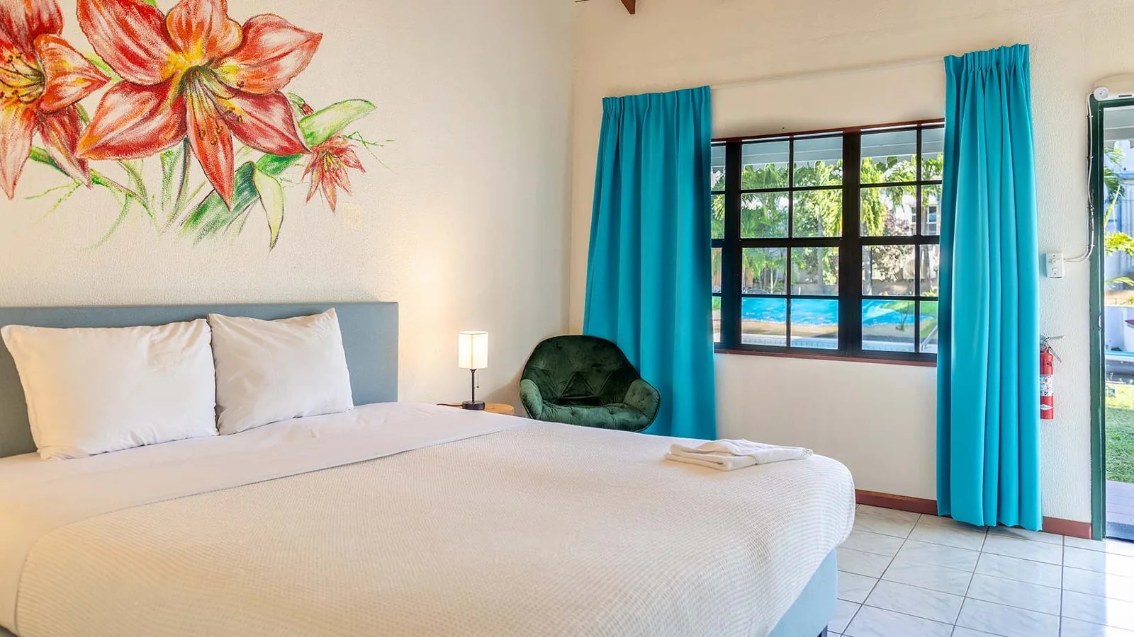 A bright studio bungalow bedroom at Talk of the Town
